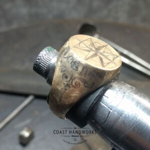 Hand engraved artwork on signet ring is first penciled out to show rough placement of elements. No computers. Hand engraved artwork on signet ring is first penciled out to show rough placement of elements.