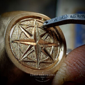 Close up of customer's geometric artwork being engraved on top of his bespoke gold signet ring Bespoke Gold Signet Ring in the Rough, Engraving Top Being Engraved